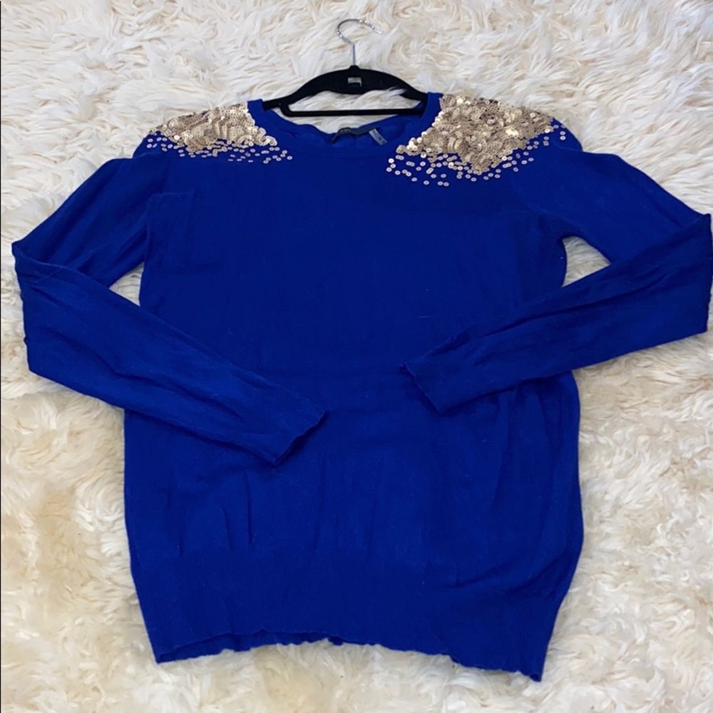 Blue sweater with gold sequin detail